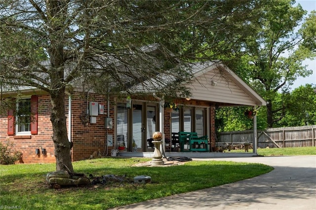 view of property's community with a yard and fence