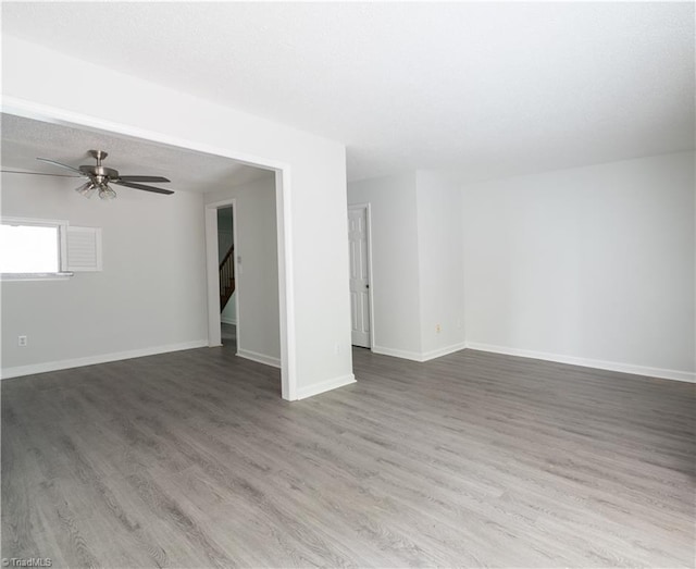 909 Shelby Dr Unit B, Greensboro, NC 27409 - empty room featuring wood finished floors, baseboards, and a ceiling fan