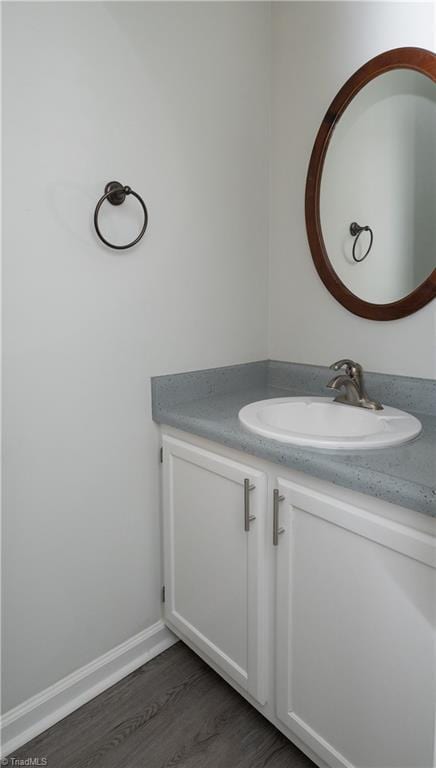 909 Shelby Dr Unit B, Greensboro, NC 27409 - bathroom featuring vanity and wood finished floors