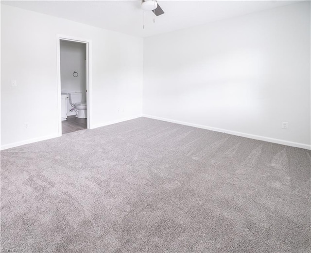 909 Shelby Dr Unit B, Greensboro, NC 27409 - spare room with a ceiling fan, dark colored carpet, and baseboards