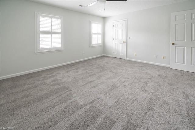 909 Shelby Dr Unit B, Greensboro, NC 27409 - carpeted empty room with a ceiling fan and baseboards