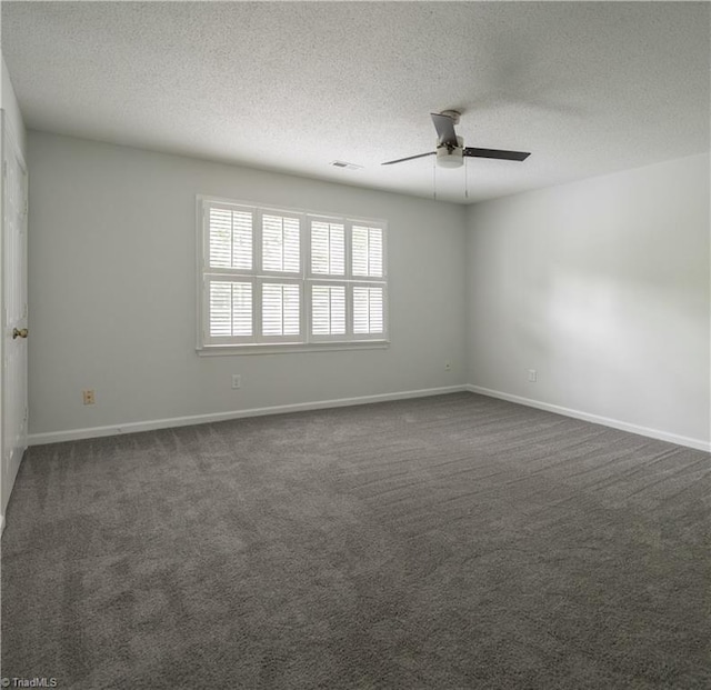 909 Shelby Dr Unit B, Greensboro, NC 27409 - empty room with a ceiling fan, a textured ceiling, dark colored carpet, and baseboards