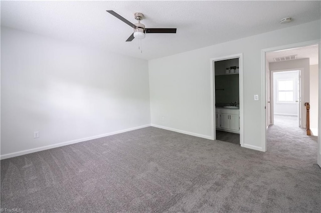 909 Shelby Dr Unit B, Greensboro, NC 27409 - unfurnished room with ceiling fan, carpet floors, a sink, and baseboards