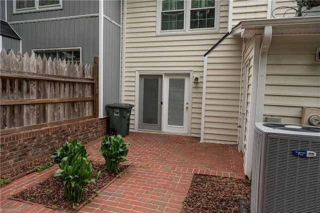 909 Shelby Dr Unit B, Greensboro, NC 27409 - property entrance with cooling unit, fence, and a patio area
