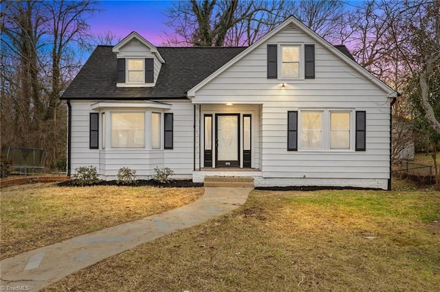 view of front of house with a yard