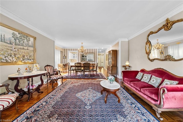 living room with ornamental molding, a notable chandelier, and parquet flooring