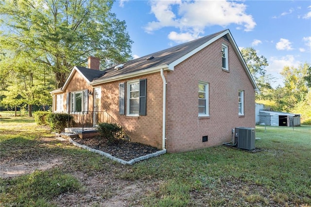 view of property exterior featuring a lawn and central AC unit