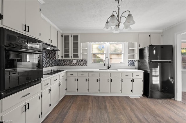 kitchen featuring white cabinetry, black appliances, sink, and dark hardwood / wood-style floors