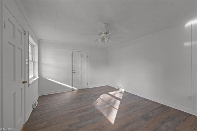 unfurnished room featuring dark hardwood / wood-style floors and ceiling fan