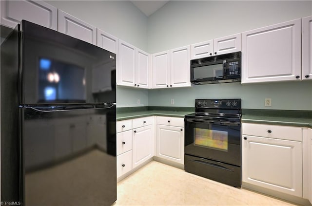 kitchen featuring white cabinets and black appliances