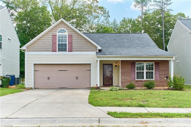 215 Trimble Dr, Elon, NC 27244 - traditional-style home featuring driveway and a front lawn