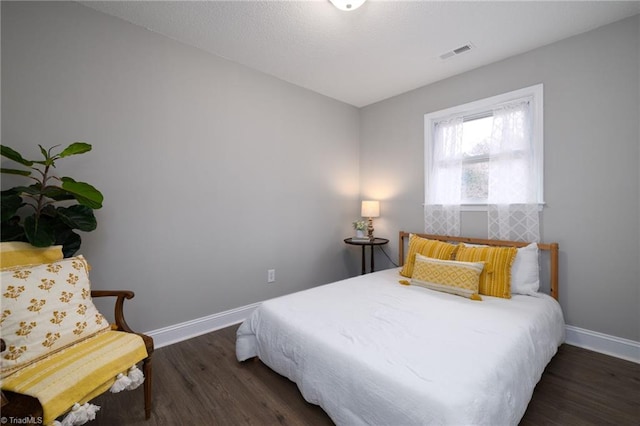 bedroom featuring dark hardwood / wood-style floors