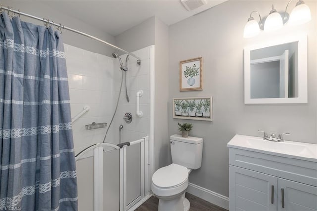 bathroom featuring hardwood / wood-style floors, vanity, and curtained shower