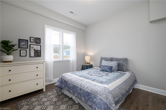 bedroom featuring dark hardwood / wood-style flooring