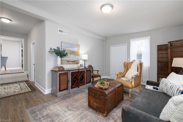 living room with dark hardwood / wood-style floors