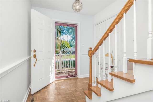 foyer featuring parquet flooring