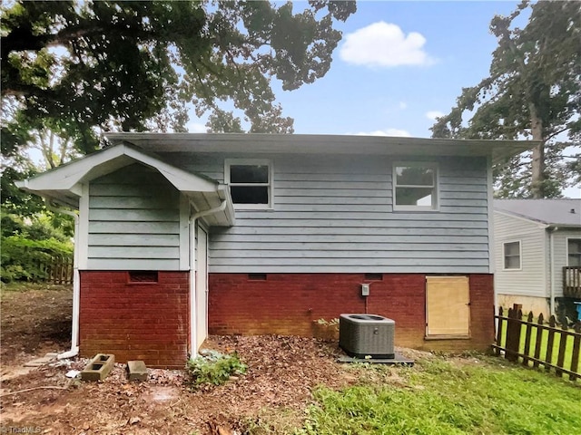 back of property featuring central AC