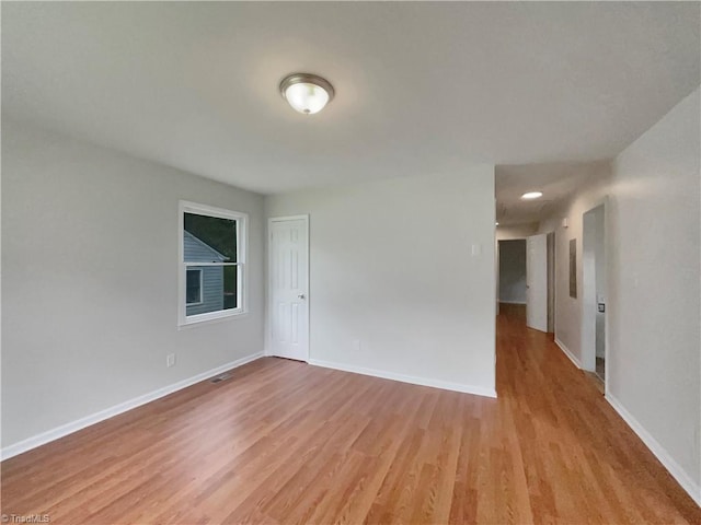 spare room with light wood-type flooring