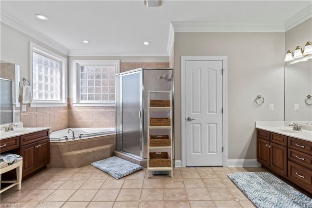 full bathroom with crown molding, a shower stall, and vanity