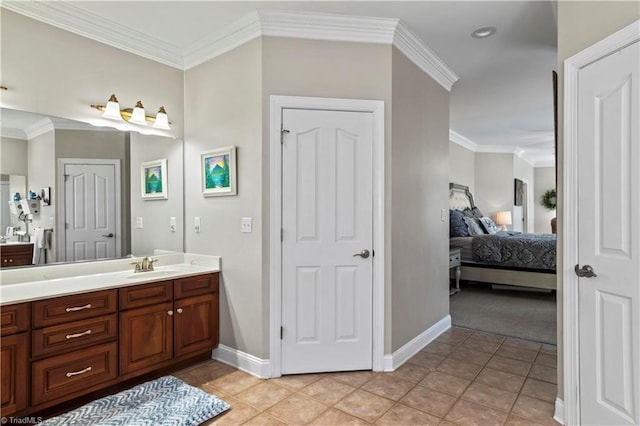 ensuite bathroom featuring ensuite bath, crown molding, and vanity