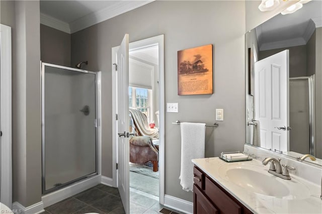 full bath featuring ornamental molding, a shower stall, vanity, tile patterned flooring, and baseboards