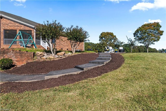 view of yard featuring playground community