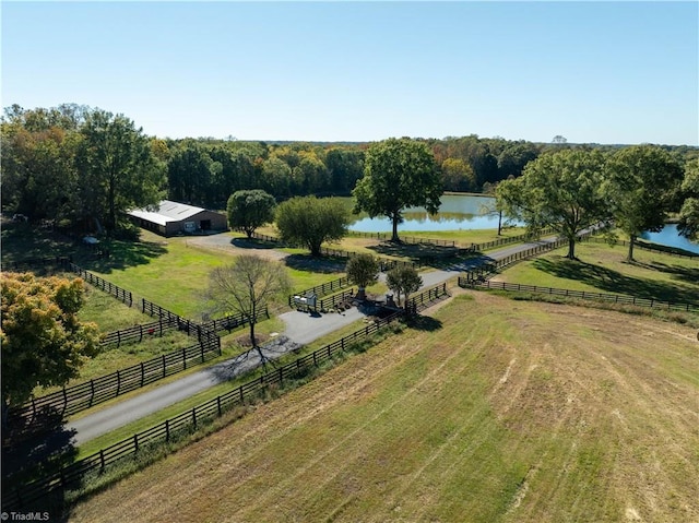 birds eye view of property with a rural view and a water view