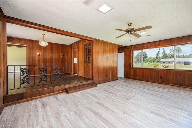 8521 US Highway 64 E, Ramseur, NC 27316 - spare room with wood walls, wood finished floors, and a ceiling fan