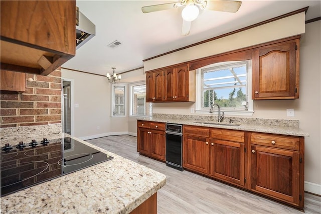 8521 US Highway 64 E, Ramseur, NC 27316 - kitchen with a sink, black electric stovetop, light wood-type flooring, crown molding, and brown cabinets