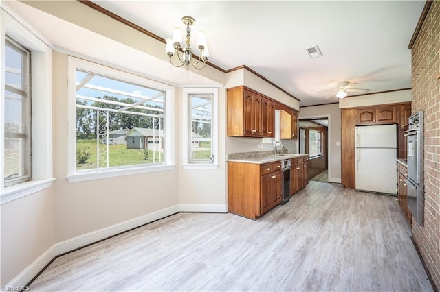 8521 US Highway 64 E, Ramseur, NC 27316 - kitchen featuring freestanding refrigerator, light countertops, light wood finished floors, a sink, and a ceiling fan