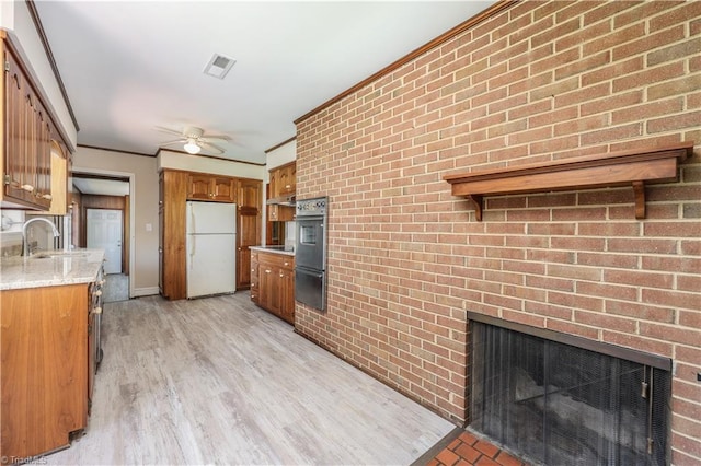8521 US Highway 64 E, Ramseur, NC 27316 - kitchen featuring freestanding refrigerator, ceiling fan, a sink, a warming drawer, and oven