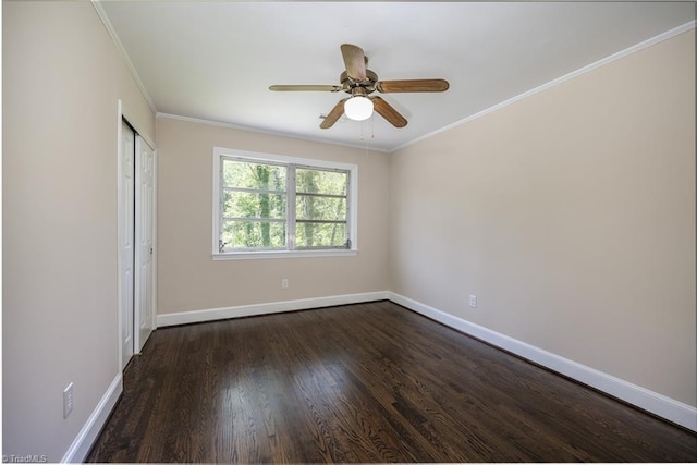 8521 US Highway 64 E, Ramseur, NC 27316 - unfurnished bedroom featuring baseboards, dark wood-style flooring, crown molding, a closet, and ceiling fan