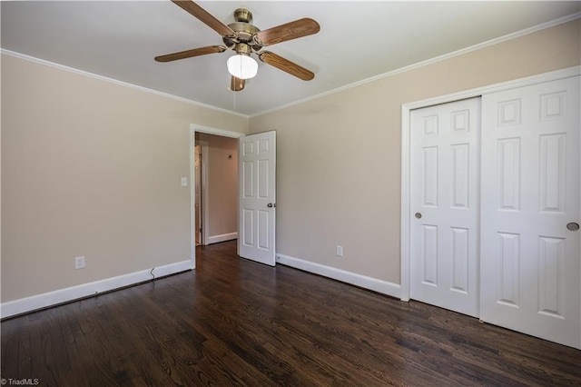 8521 US Highway 64 E, Ramseur, NC 27316 - unfurnished bedroom with dark wood finished floors, baseboards, crown molding, a closet, and ceiling fan