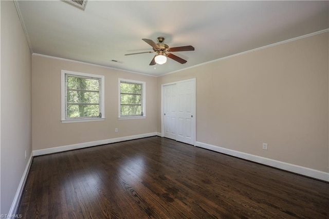 8521 US Highway 64 E, Ramseur, NC 27316 - spare room featuring ceiling fan, ornamental molding, baseboards, and dark wood-type flooring