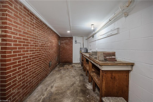 8521 US Highway 64 E, Ramseur, NC 27316 - hallway with unfinished concrete floors and brick wall