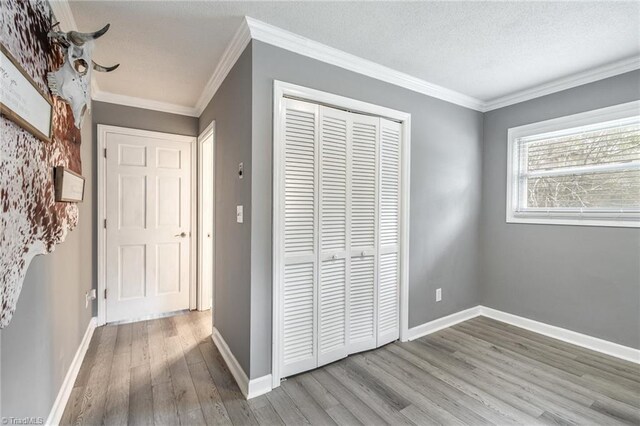 full bathroom with vanity, crown molding, hardwood / wood-style floors, and toilet