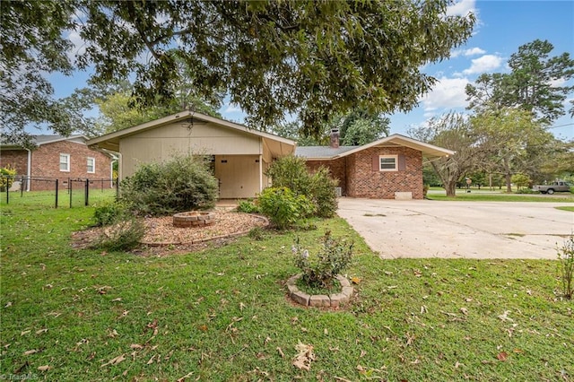 view of side of home featuring a lawn