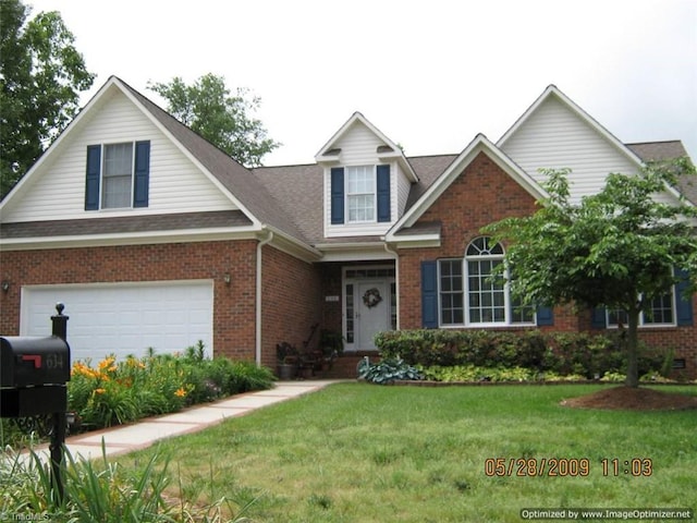 view of front facade featuring a garage and a front lawn