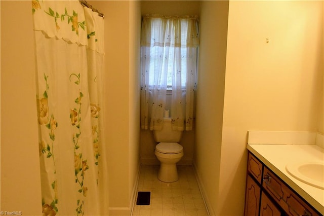 bathroom with toilet and vanity