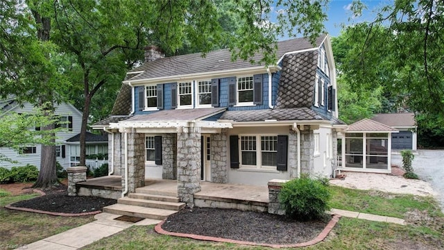 exterior space featuring a porch and a garage