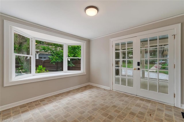 empty room with french doors and plenty of natural light