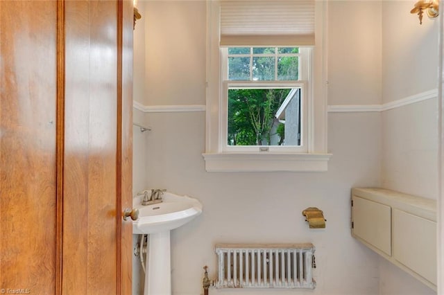 bathroom with radiator and toilet