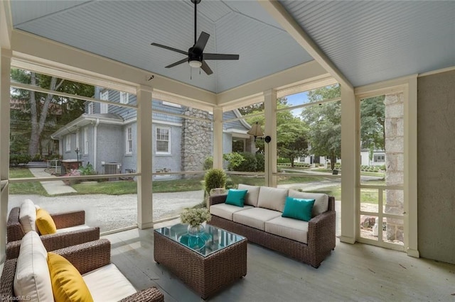 sunroom / solarium with vaulted ceiling and ceiling fan