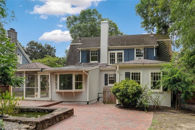 back of house with a patio area