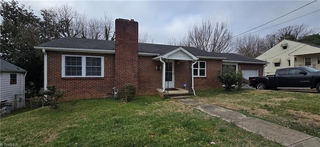 view of front of home featuring a front yard, brick siding, an attached garage, and a chimney