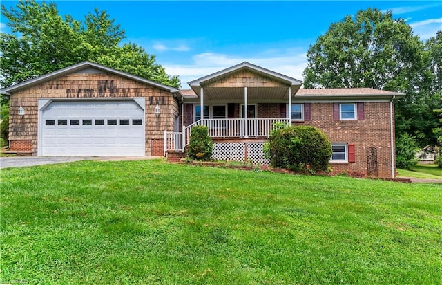 103 E St, Jonesville, NC 28642 - single story home featuring a front lawn, a porch, and brick siding