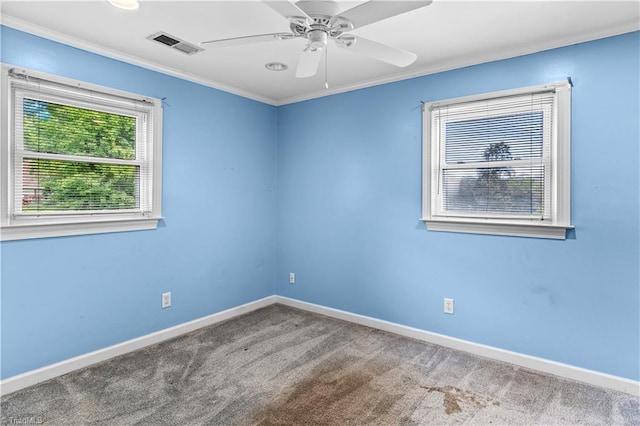 103 E St, Jonesville, NC 28642 - unfurnished room featuring ornamental molding, carpet, and a ceiling fan