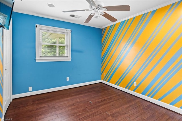 103 E St, Jonesville, NC 28642 - spare room with crown molding, wood finished floors, a ceiling fan, and wallpapered walls