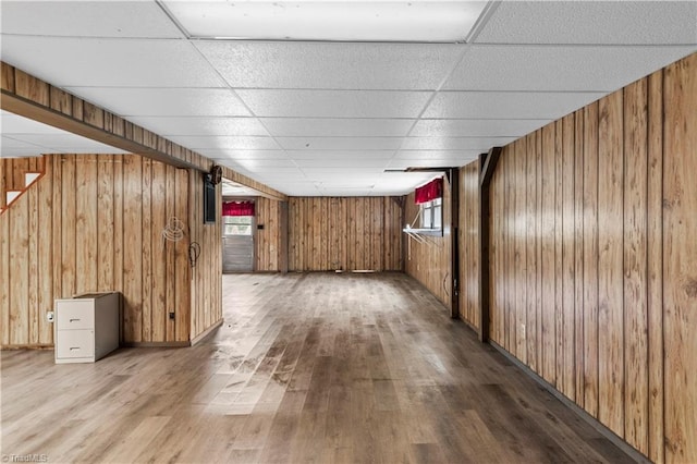 103 E St, Jonesville, NC 28642 - below grade area with wood finished floors, wooden walls, a paneled ceiling, and healthy amount of natural light