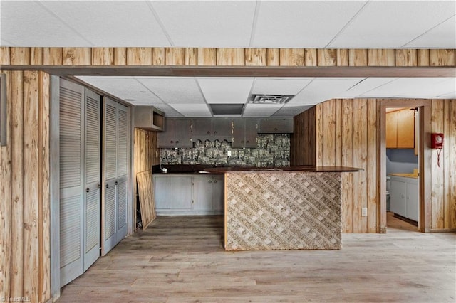 103 E St, Jonesville, NC 28642 - bar area with a drop ceiling, light wood-type flooring, and wood walls